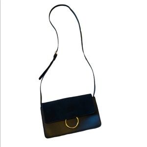 Black leather crossbody bag with suede flap